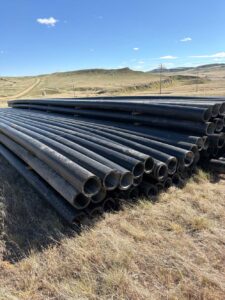 Legacy HDPE reclaimed HDPE prairie logged pipe stock in field